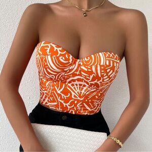 Orange and White Strapless Top with Black Shorts